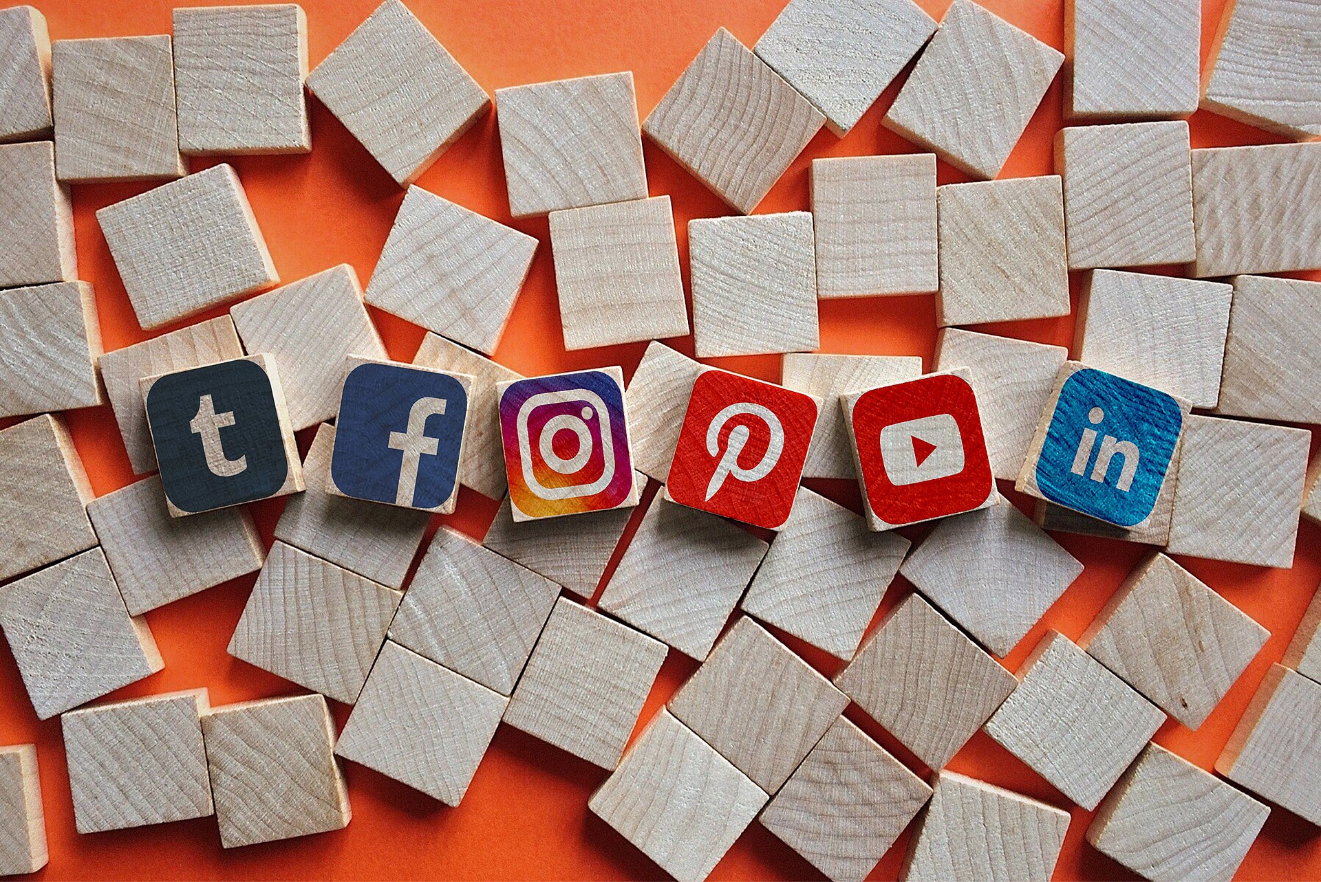 image of social media icons printed on wooden building blocks